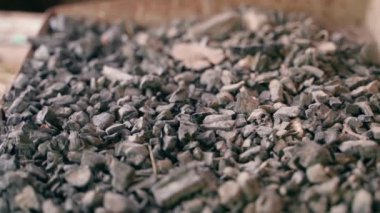 Mound of coal close-up. Smooth camera movement over fossil black fine coal. Raw materials for heating and generating electricity. Fossil resource industry from the bowels of planet earth. High quality