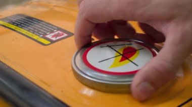 Close-up of unscrewing the gas tank cap of a gas generator. The hand unscrews and tightens the fuel filler cap. Filling a canister at a petrol station. High quality 4k footage