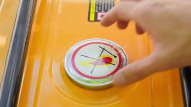 Close-up of unscrewing the gas tank cap of a gas generator. The hand unscrews and tightens the fuel filler cap. Filling a canister at a petrol station. High quality 4k footage