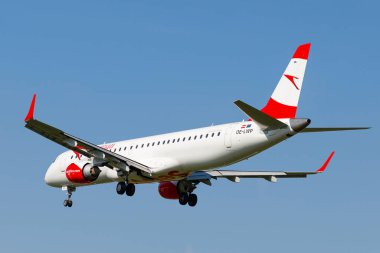 LVIV, UKRAINE - September 12, 2021: Austrian Airlines embraer 195 plane in flight. The plane is flying.