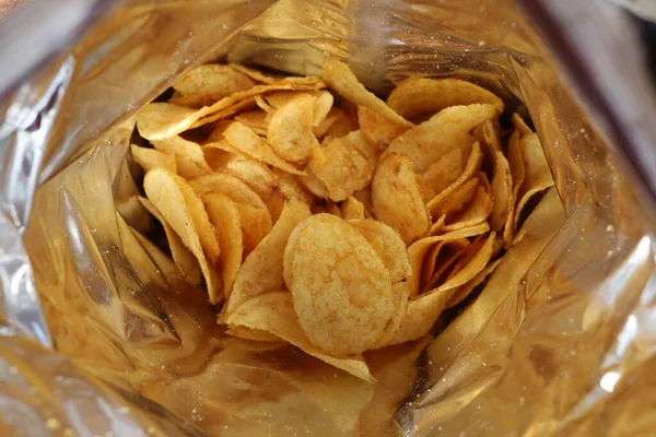 Potato chips in a package inside. Snacks in a package close-up.