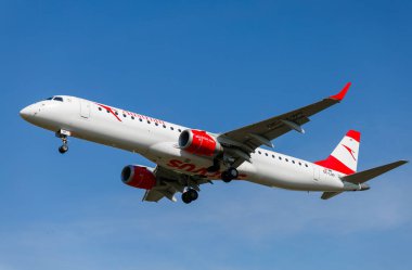 LVIV, UKRAINE - September 12, 2021: Austrian Airlines embraer 195 plane in flight. The plane is flying.