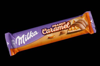 LVIV, UKRAINE - September 14, 2021: Milka Caramel peanut chocolate bar