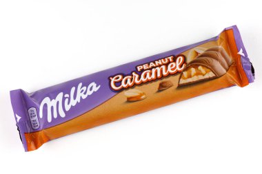 LVIV, UKRAINE - September 14, 2021: Milka Caramel peanut chocolate bar