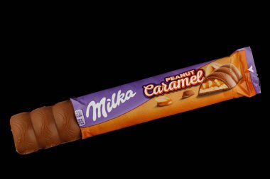 LVIV, UKRAINE - September 14, 2021: Milka Caramel peanut chocolate bar