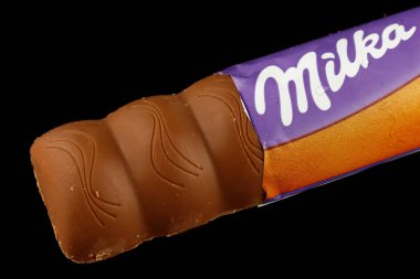 LVIV, UKRAINE - September 14, 2021: Milka Caramel peanut chocolate bar