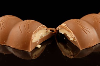 LVIV, UKRAINE - September 14, 2021: Milka Caramel peanut chocolate bar