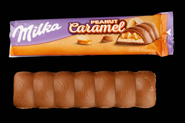 LVIV, UKRAINE - September 14, 2021: Milka Caramel peanut chocolate bar
