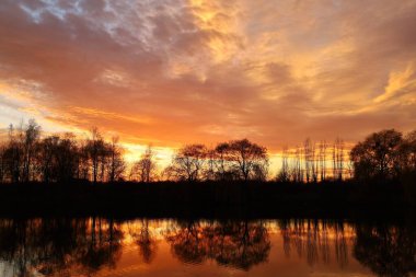 Red sky over the water. Night landscape