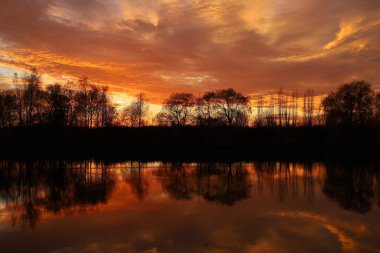 Red sky over the water. Night landscape