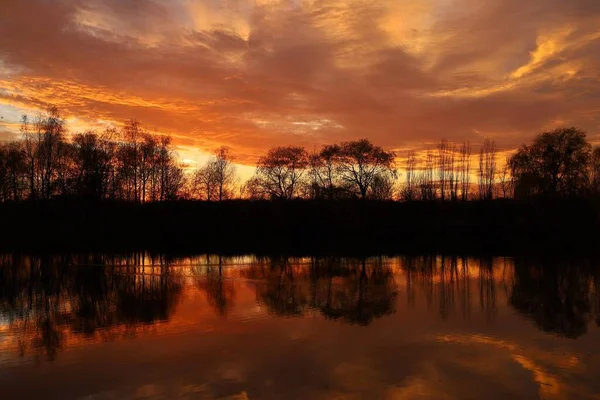 Red sky over the water. Night landscape
