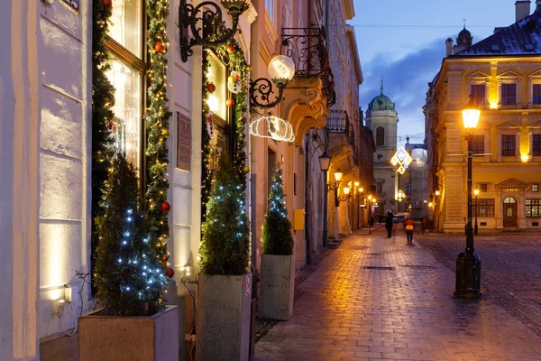 LVIV, UKRAINE - December 21, 2021: Market Square at night