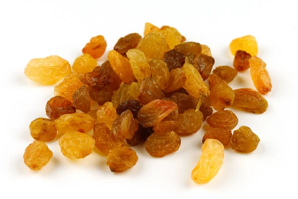 Beyaz zemin üzerine sarı kuru üzüm