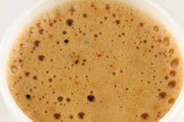 Mokka coffee drink with foam in a white cup