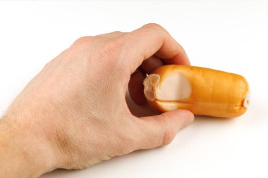 Raw sausage in hand isolate