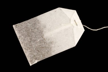A bag of tea is new black background