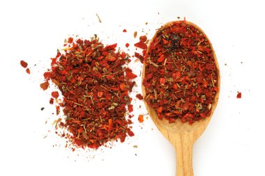 seasoning for pilaf in a wooden spoon