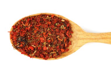 seasoning for pilaf in a wooden spoon