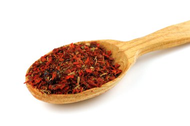 seasoning for pilaf in a wooden spoon