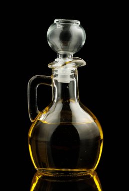 Glass vessel with oil black background