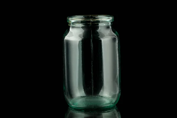Empty glass jar black background