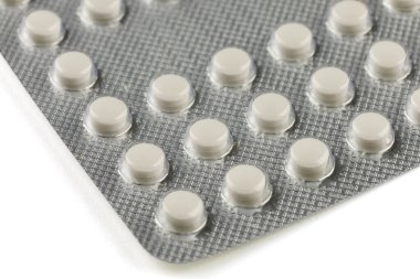 White pills in a transparent blister