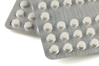 White pills in a transparent blister