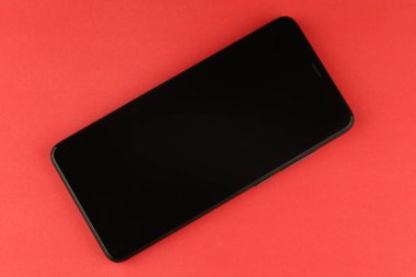 Black smartphone on a colored background
