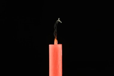 Extinguished candle close-up. Isolate