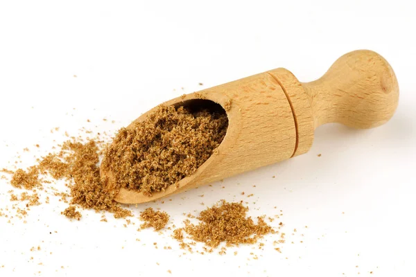 Ground coriander seasoning scoop close-up