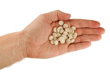 Brewer's yeast in tablets in hand
