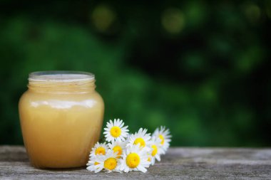 Honey in a jar on the pass.