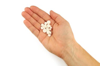 White pills in hand isolate