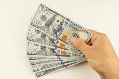 American money dollars in hand