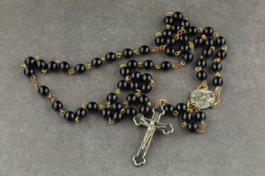 Catholic rosary beads. black rosary close-up