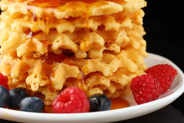 Belgian waffles with honey and berries