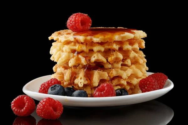 Belgian waffles with honey and berries
