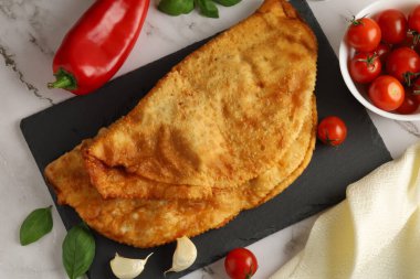 Chebureks with meat. East meat pastry cheburek. Fried chebureks, close-up