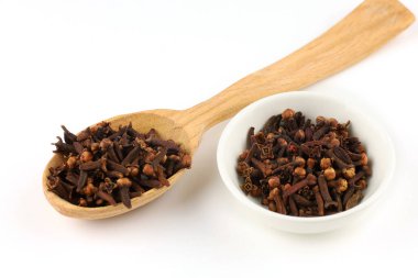 Clove spice in a wooden spoon