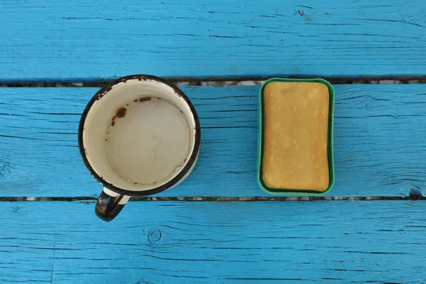 Water in a cup and soap. Clean hands