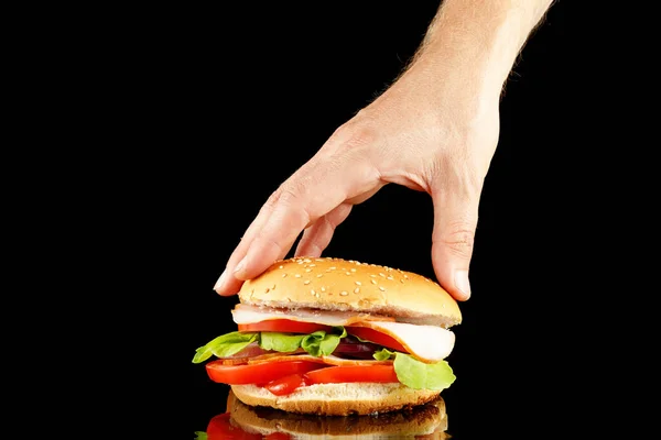 Burger Hand Isoleren Zwart — Stockfoto