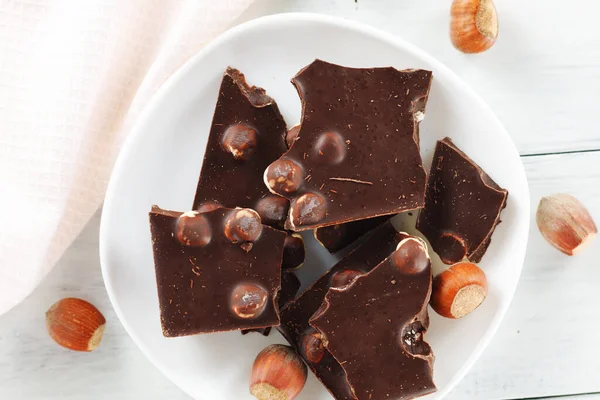 Broken Chocolate Nuts White Plate — Stock Photo, Image