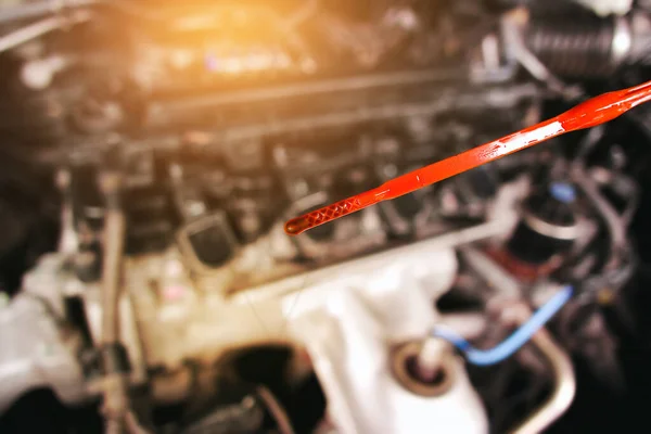 Deteriorating Car Oil Dipstick Background Blurred Engine Compartment Automotive Maintenance — Stockfoto