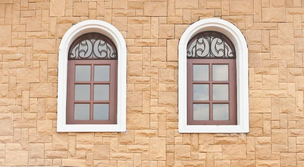 Stone wall with windows — Stock Photo, Image