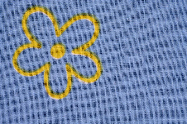 Texture tissu en bleu avec fleur jaune — Photo