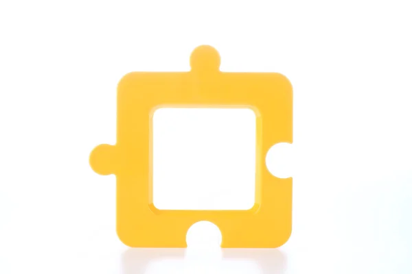 Moldura de foto em forma de quebra-cabeça em amarelo — Fotografia de Stock