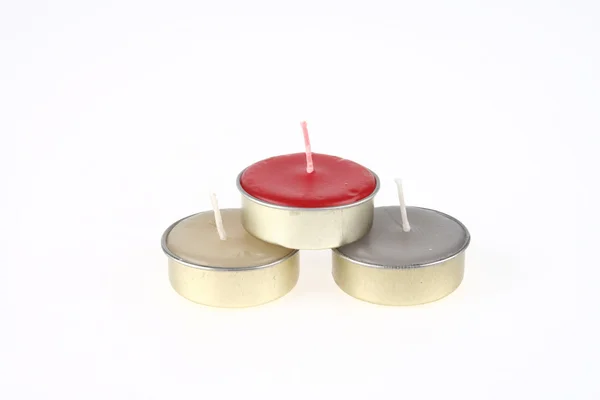 Tres velas de spa no utilizadas en color rojo, crema y gris —  Fotos de Stock