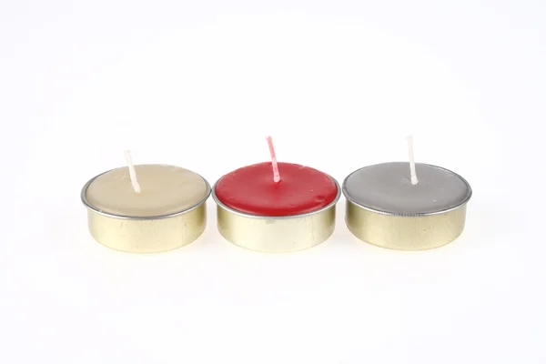 Tres velas de spa no utilizadas en color rojo, crema y gris Fotos de stock