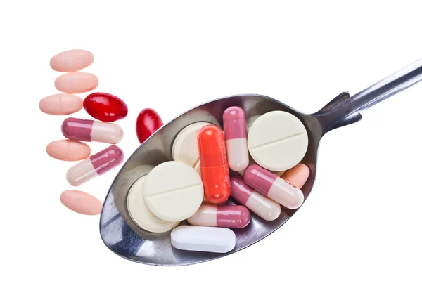 Kleurrijke geneeskunde tabletten op witte achtergrond — Stockfoto