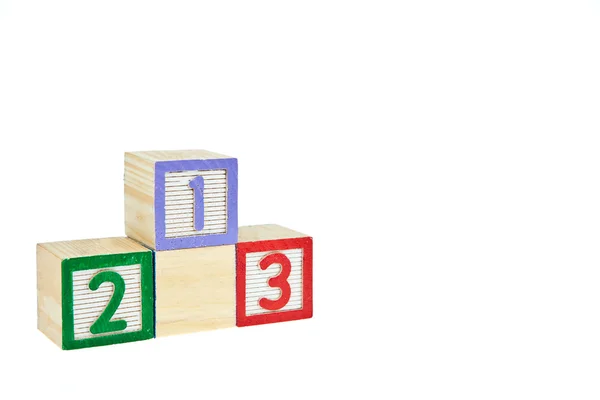 Nummer 123 aus Buchstaben-Holzklötzen als Podest — Stockfoto